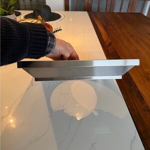 ZLINE Kitchen and Bath Stainless Steel Range Hood vent crown molding.